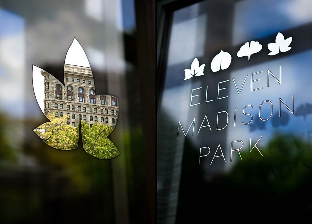 Details of the didning room, bar and kitchen of Eleven Madison Park in NYC.